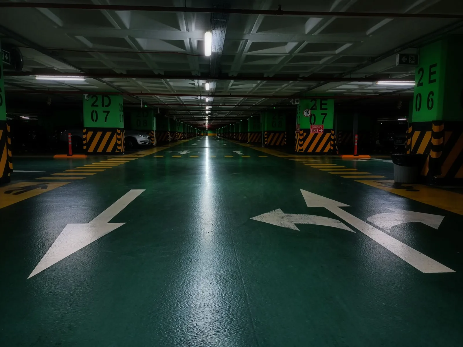 garage floor coating cost — epoxy applied to a two-car garage floor
