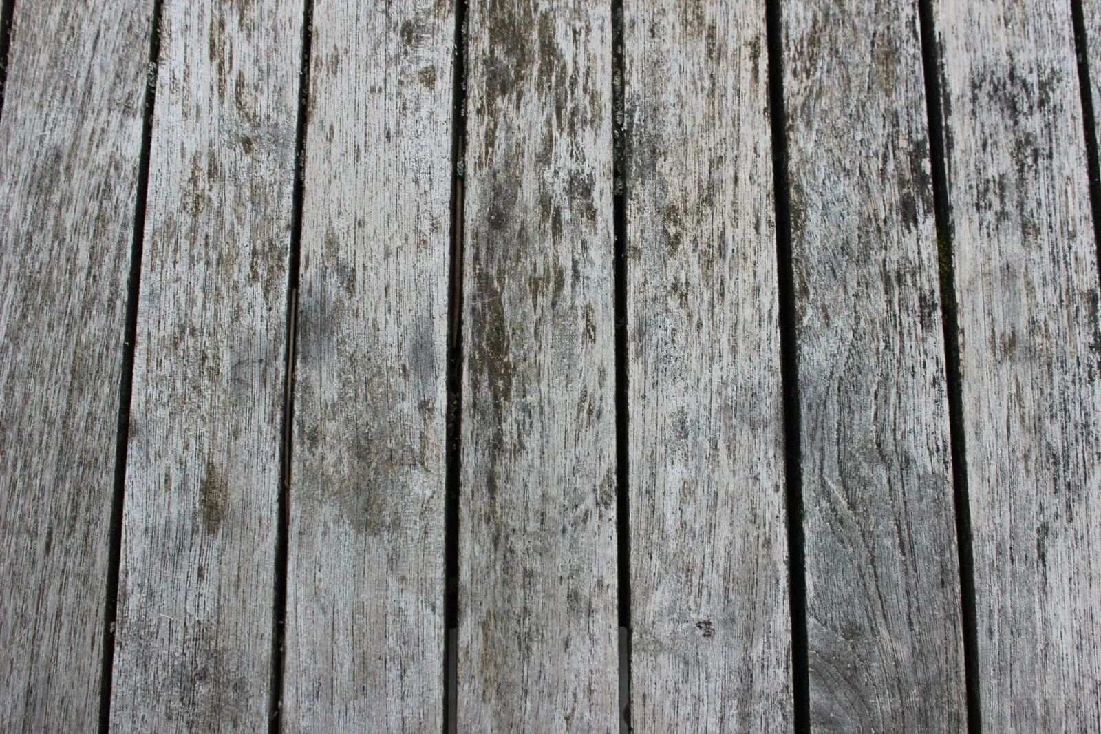 Applying deck sealer with a roller