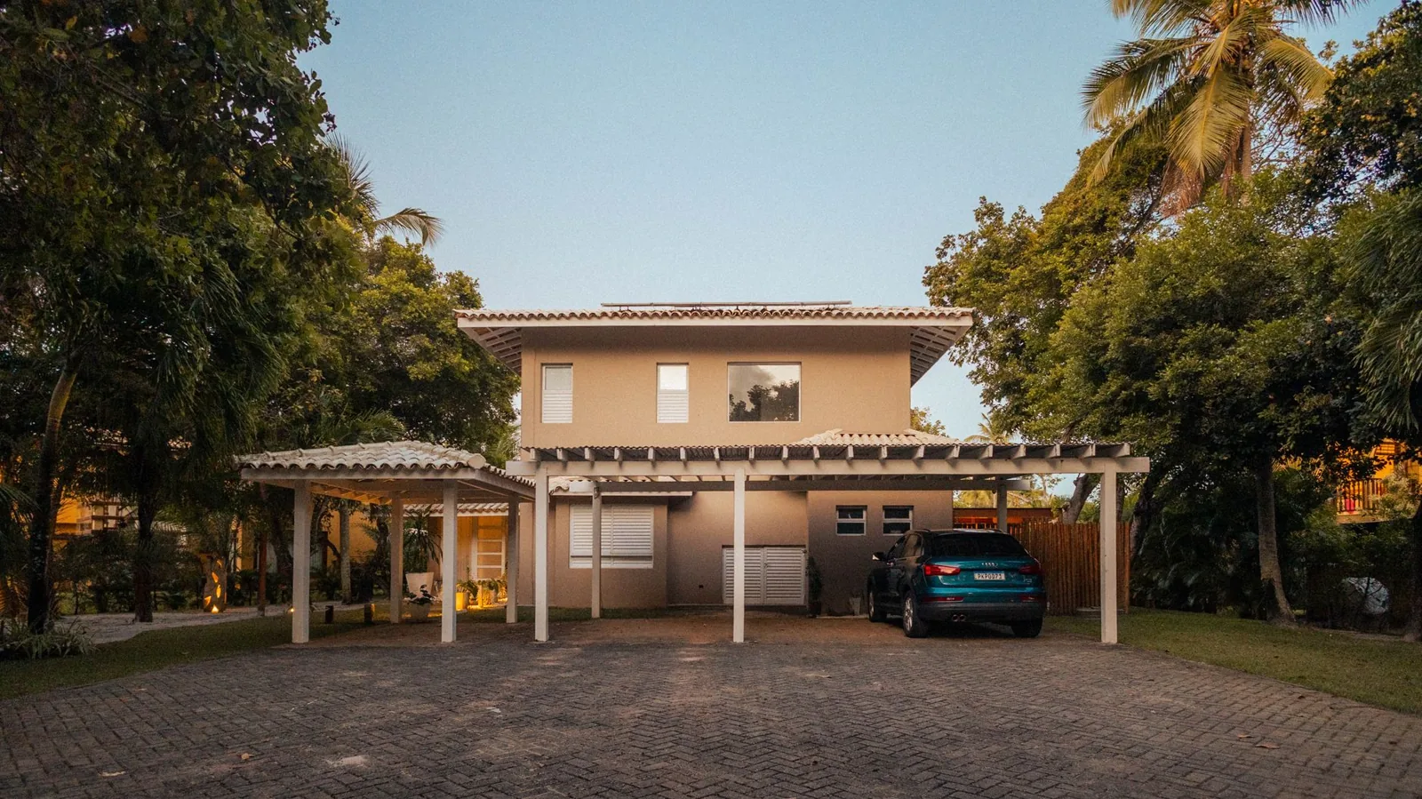 metal freestanding carport with solar panels and a concrete pad