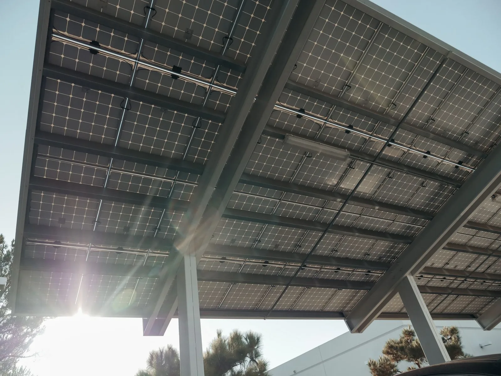 A steel carport kit can cut a metal carport cost by thousands versus custom