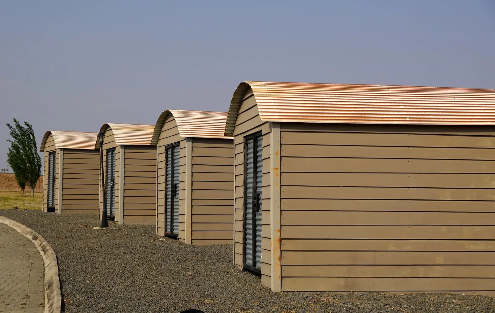 large wood shed with double doors