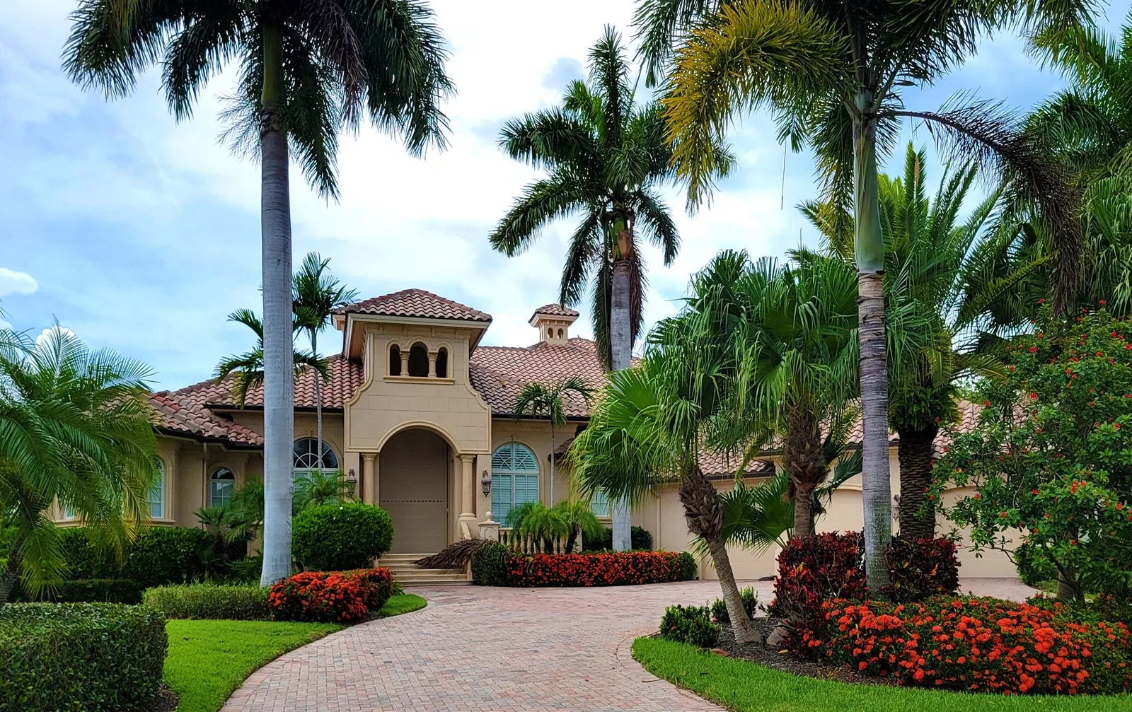 Natural stone and paver hardscaping carry the highest per-square-foot materials cost